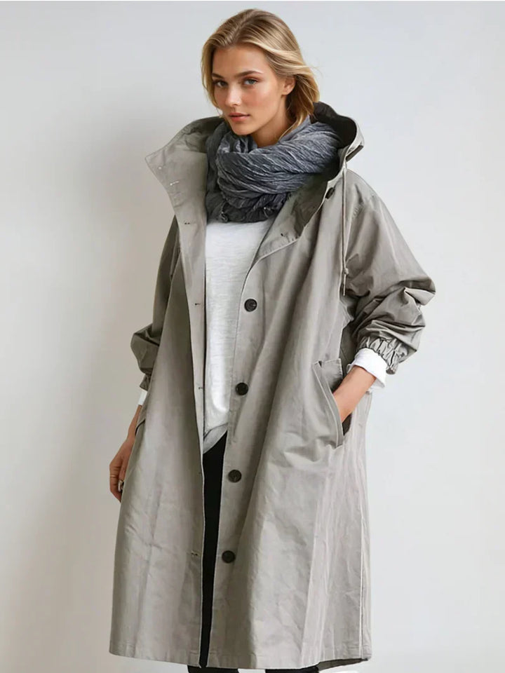Imperméable femme avec capuche et ceinture – manteau de pluie élégant