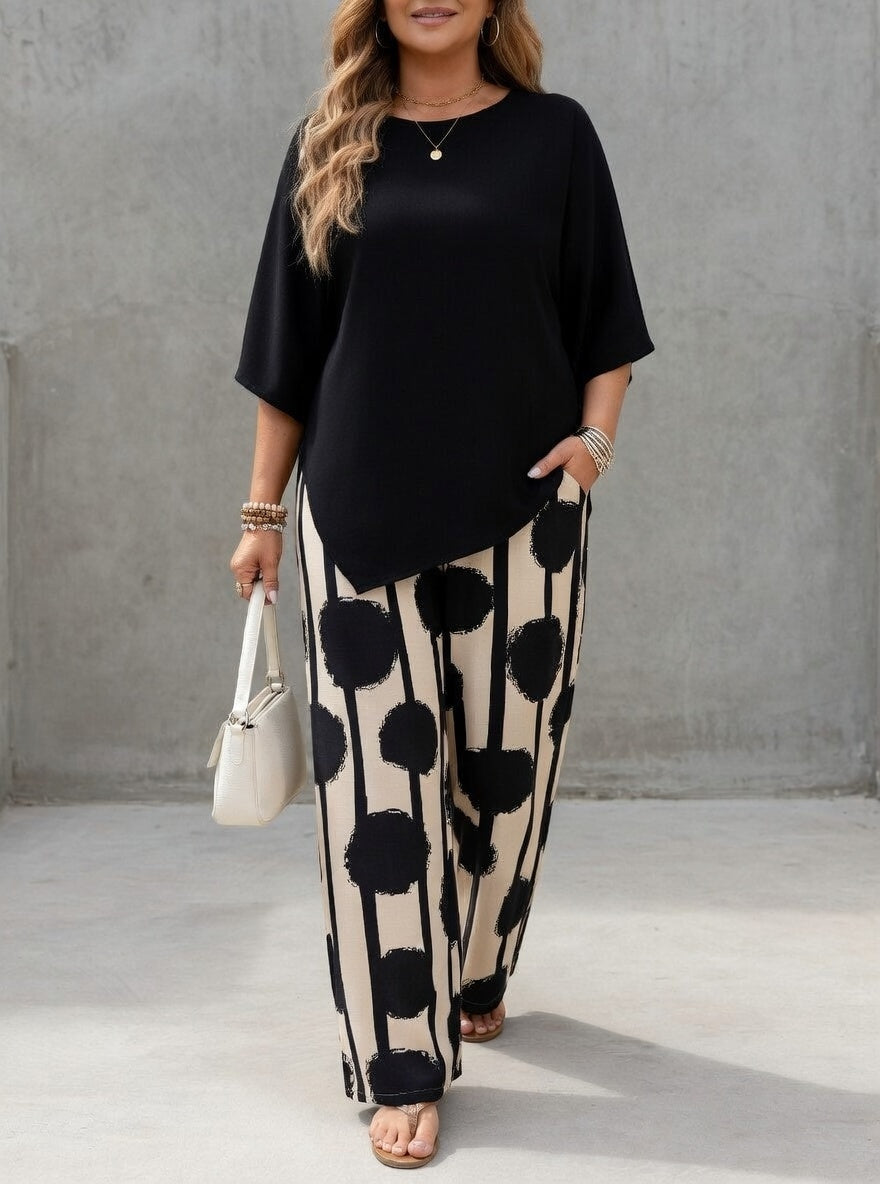Ensemble femme élégant avec top asymétrique fluide et pantalon imprimé