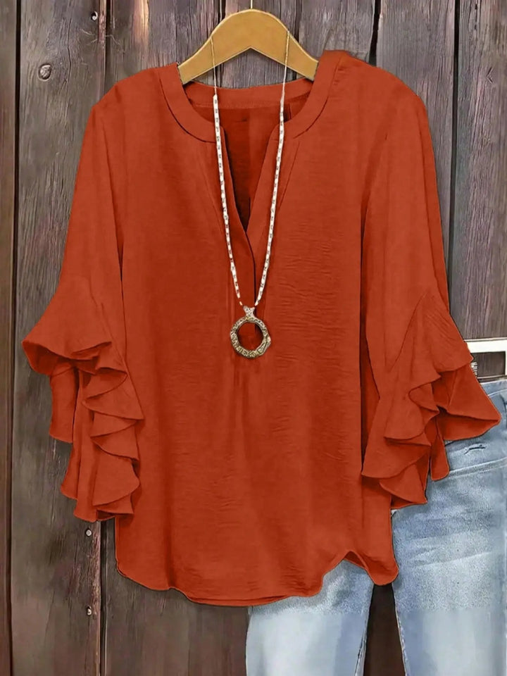 Blouse femme à manches volantées et col V élégant