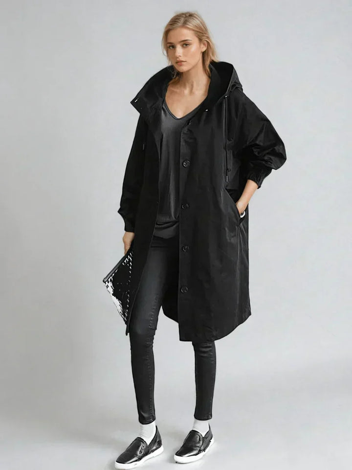 Imperméable femme avec capuche et ceinture – manteau de pluie élégant